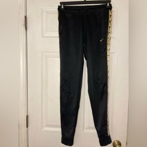Nike womens sweats with gold side trim